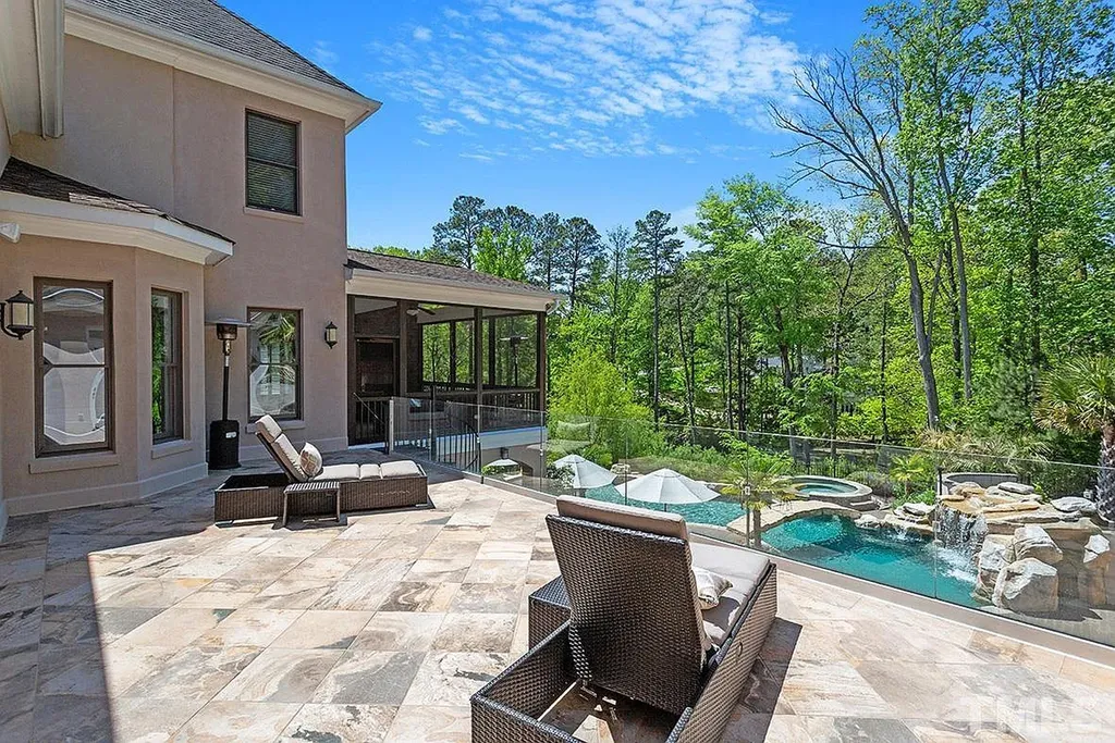 6205 Autrey Court Home in Raleigh, North Carolina. Experience the ultimate staycation in this magnificent home that exudes elegance and offers a host of luxurious features. A recent kitchen refresh showcases stunning quartz countertops and backsplash, complemented by new appliances. The integration of Control 4 Home Automation allows for seamless control of various systems within the home. Fresh paint, updated fixtures, and new carpet throughout create a fresh and inviting ambiance.