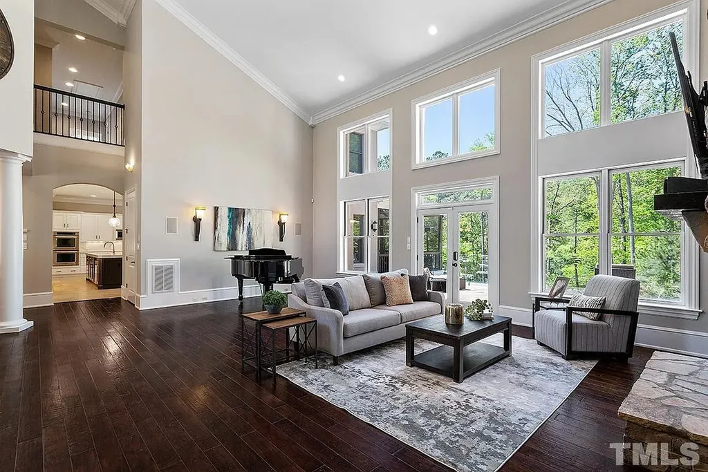 6205 Autrey Court Home in Raleigh, North Carolina. Experience the ultimate staycation in this magnificent home that exudes elegance and offers a host of luxurious features. A recent kitchen refresh showcases stunning quartz countertops and backsplash, complemented by new appliances. The integration of Control 4 Home Automation allows for seamless control of various systems within the home. Fresh paint, updated fixtures, and new carpet throughout create a fresh and inviting ambiance.