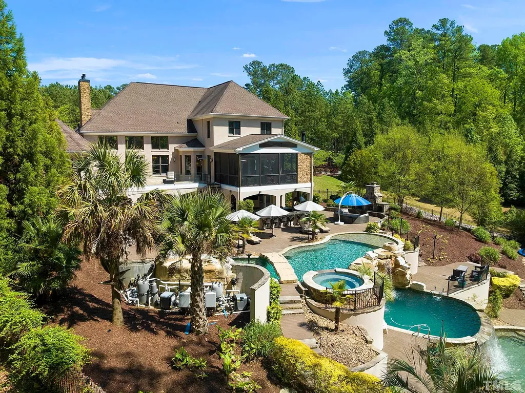 6205 Autrey Court Home in Raleigh, North Carolina. Experience the ultimate staycation in this magnificent home that exudes elegance and offers a host of luxurious features. A recent kitchen refresh showcases stunning quartz countertops and backsplash, complemented by new appliances. The integration of Control 4 Home Automation allows for seamless control of various systems within the home. Fresh paint, updated fixtures, and new carpet throughout create a fresh and inviting ambiance.