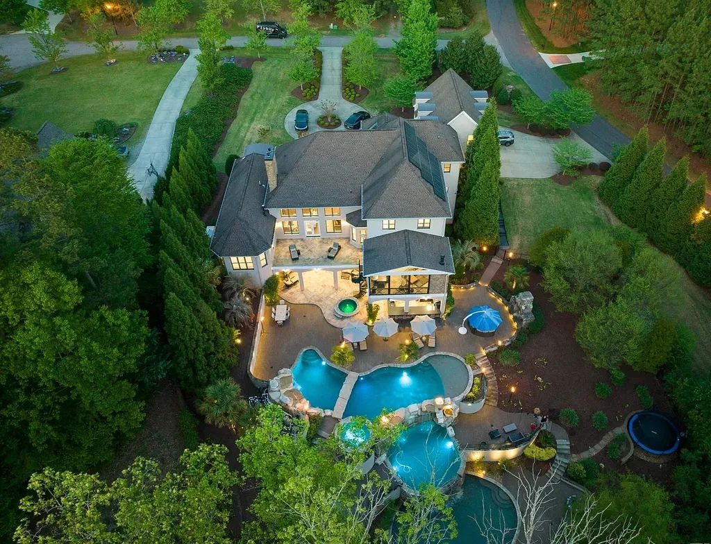 6205 Autrey Court Home in Raleigh, North Carolina. Experience the ultimate staycation in this magnificent home that exudes elegance and offers a host of luxurious features. A recent kitchen refresh showcases stunning quartz countertops and backsplash, complemented by new appliances. The integration of Control 4 Home Automation allows for seamless control of various systems within the home. Fresh paint, updated fixtures, and new carpet throughout create a fresh and inviting ambiance.