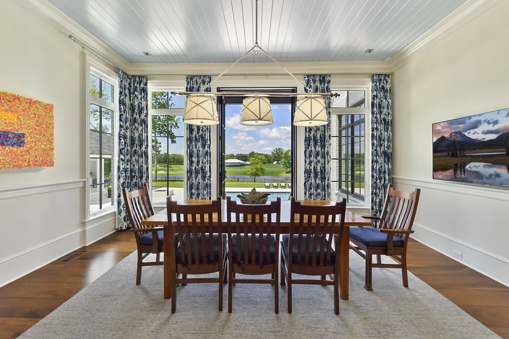 7214 Baltusrol Lane Home in Charlotte, North Carolina. Recently renovated with custom details, including Canadian Black Walnut hardwoods and Italian Calacatta marble, this home exudes elegance. The chef's kitchen, luxurious primary suite, and outdoor entertainment area with a pool and fireplace make this home the epitome of luxury. With a 3-car garage and golf cart bay, it caters to every need. Don't miss this opportunity to own a truly remarkable property.