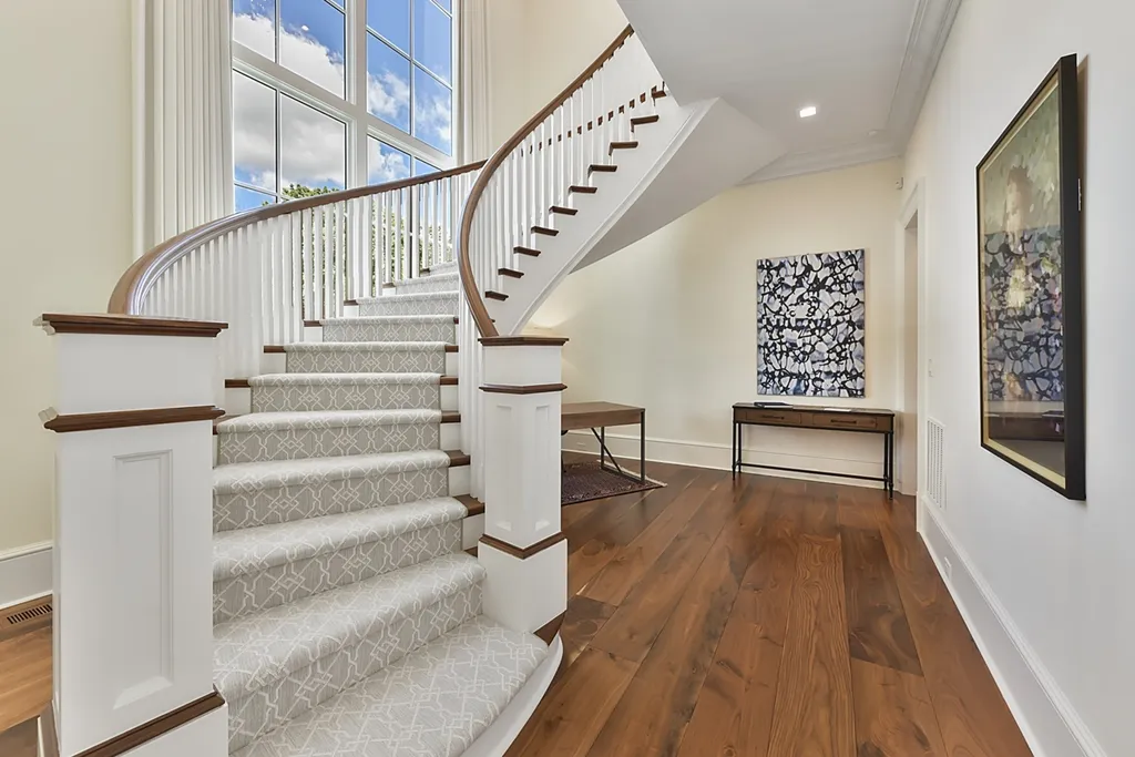 7214 Baltusrol Lane Home in Charlotte, North Carolina. Recently renovated with custom details, including Canadian Black Walnut hardwoods and Italian Calacatta marble, this home exudes elegance. The chef's kitchen, luxurious primary suite, and outdoor entertainment area with a pool and fireplace make this home the epitome of luxury. With a 3-car garage and golf cart bay, it caters to every need. Don't miss this opportunity to own a truly remarkable property.