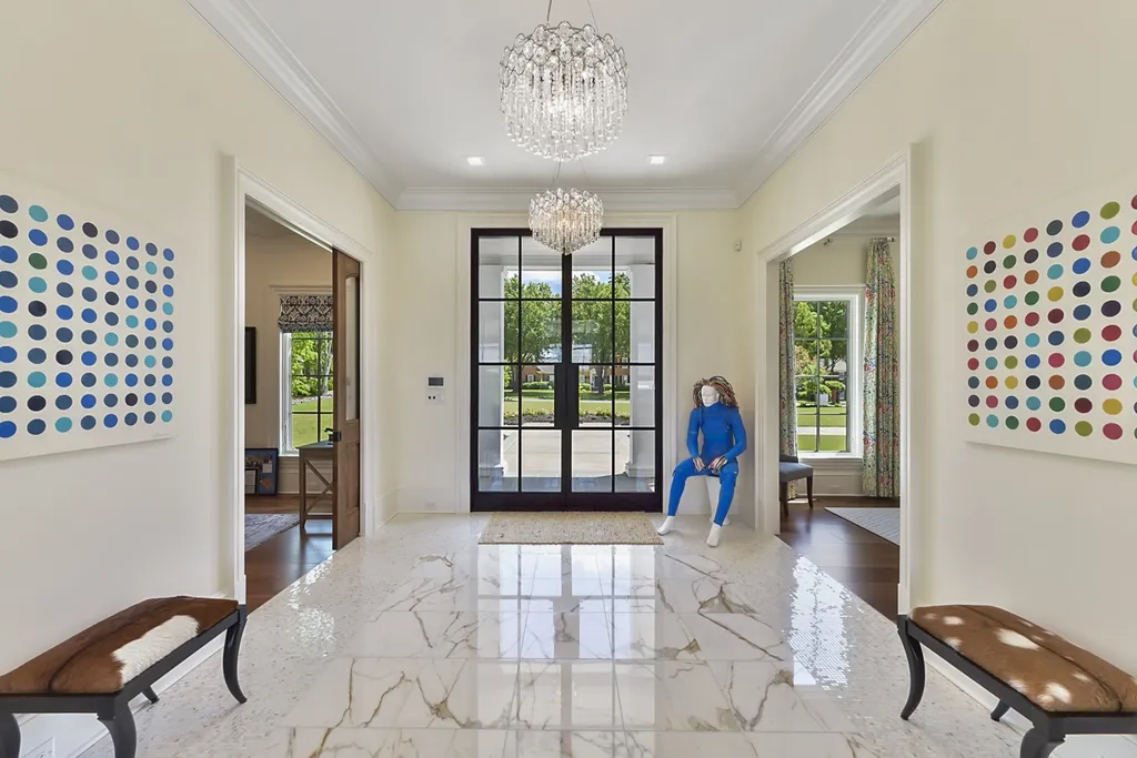 7214 Baltusrol Lane Home in Charlotte, North Carolina. Recently renovated with custom details, including Canadian Black Walnut hardwoods and Italian Calacatta marble, this home exudes elegance. The chef's kitchen, luxurious primary suite, and outdoor entertainment area with a pool and fireplace make this home the epitome of luxury. With a 3-car garage and golf cart bay, it caters to every need. Don't miss this opportunity to own a truly remarkable property.