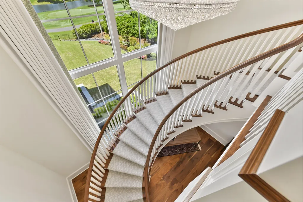7214 Baltusrol Lane Home in Charlotte, North Carolina. Recently renovated with custom details, including Canadian Black Walnut hardwoods and Italian Calacatta marble, this home exudes elegance. The chef's kitchen, luxurious primary suite, and outdoor entertainment area with a pool and fireplace make this home the epitome of luxury. With a 3-car garage and golf cart bay, it caters to every need. Don't miss this opportunity to own a truly remarkable property.