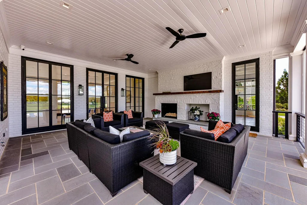 7214 Baltusrol Lane Home in Charlotte, North Carolina. Recently renovated with custom details, including Canadian Black Walnut hardwoods and Italian Calacatta marble, this home exudes elegance. The chef's kitchen, luxurious primary suite, and outdoor entertainment area with a pool and fireplace make this home the epitome of luxury. With a 3-car garage and golf cart bay, it caters to every need. Don't miss this opportunity to own a truly remarkable property.