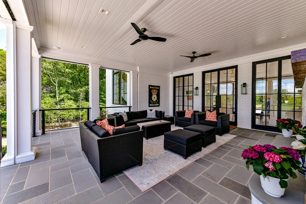 7214 Baltusrol Lane Home in Charlotte, North Carolina. Recently renovated with custom details, including Canadian Black Walnut hardwoods and Italian Calacatta marble, this home exudes elegance. The chef's kitchen, luxurious primary suite, and outdoor entertainment area with a pool and fireplace make this home the epitome of luxury. With a 3-car garage and golf cart bay, it caters to every need. Don't miss this opportunity to own a truly remarkable property.