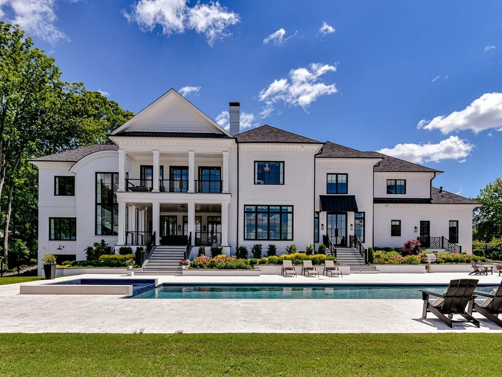 7214 Baltusrol Lane Home in Charlotte, North Carolina. Recently renovated with custom details, including Canadian Black Walnut hardwoods and Italian Calacatta marble, this home exudes elegance. The chef's kitchen, luxurious primary suite, and outdoor entertainment area with a pool and fireplace make this home the epitome of luxury. With a 3-car garage and golf cart bay, it caters to every need. Don't miss this opportunity to own a truly remarkable property.