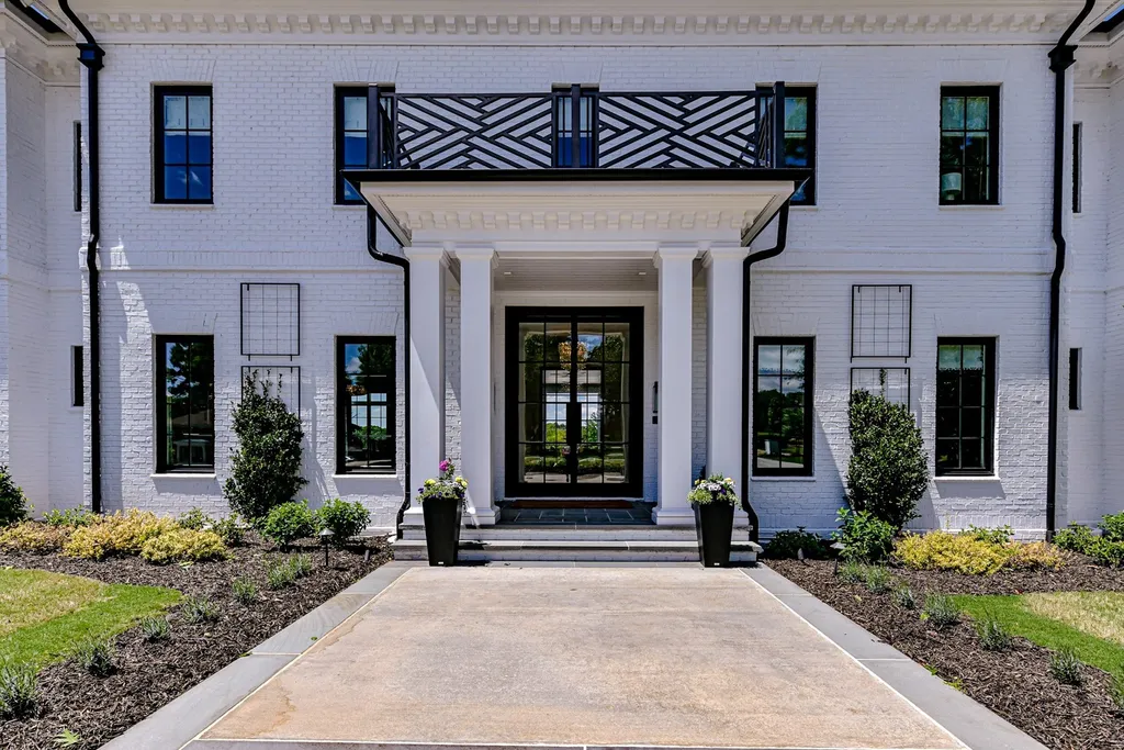 7214 Baltusrol Lane Home in Charlotte, North Carolina. Recently renovated with custom details, including Canadian Black Walnut hardwoods and Italian Calacatta marble, this home exudes elegance. The chef's kitchen, luxurious primary suite, and outdoor entertainment area with a pool and fireplace make this home the epitome of luxury. With a 3-car garage and golf cart bay, it caters to every need. Don't miss this opportunity to own a truly remarkable property.