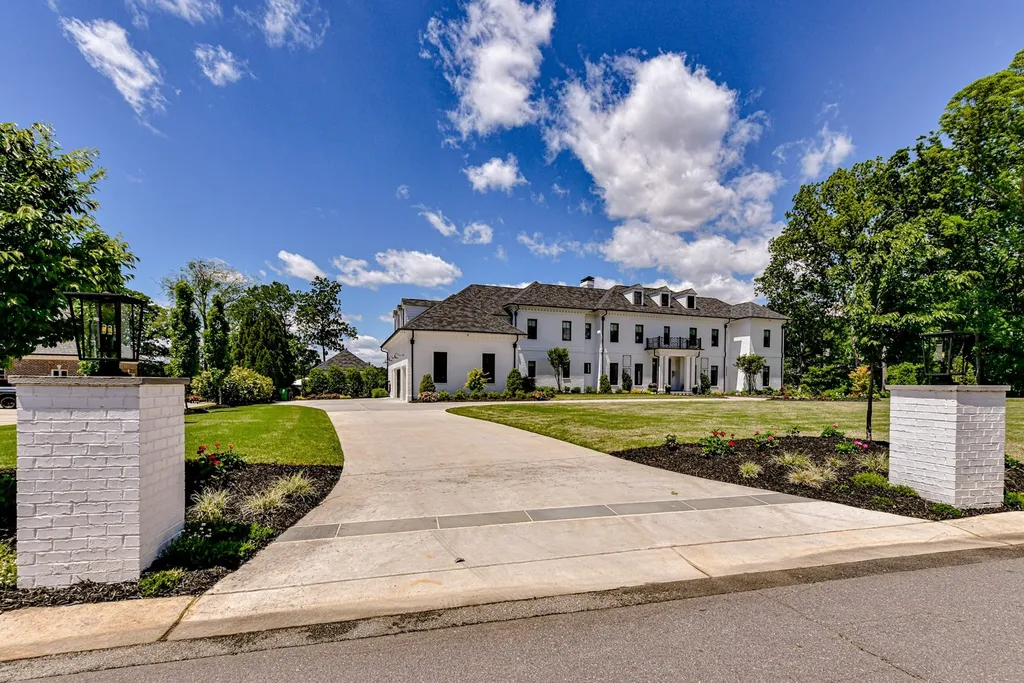 7214 Baltusrol Lane Home in Charlotte, North Carolina. Recently renovated with custom details, including Canadian Black Walnut hardwoods and Italian Calacatta marble, this home exudes elegance. The chef's kitchen, luxurious primary suite, and outdoor entertainment area with a pool and fireplace make this home the epitome of luxury. With a 3-car garage and golf cart bay, it caters to every need. Don't miss this opportunity to own a truly remarkable property.
