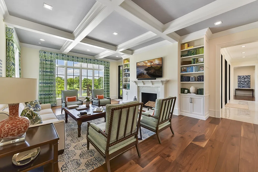 7214 Baltusrol Lane Home in Charlotte, North Carolina. Recently renovated with custom details, including Canadian Black Walnut hardwoods and Italian Calacatta marble, this home exudes elegance. The chef's kitchen, luxurious primary suite, and outdoor entertainment area with a pool and fireplace make this home the epitome of luxury. With a 3-car garage and golf cart bay, it caters to every need. Don't miss this opportunity to own a truly remarkable property.