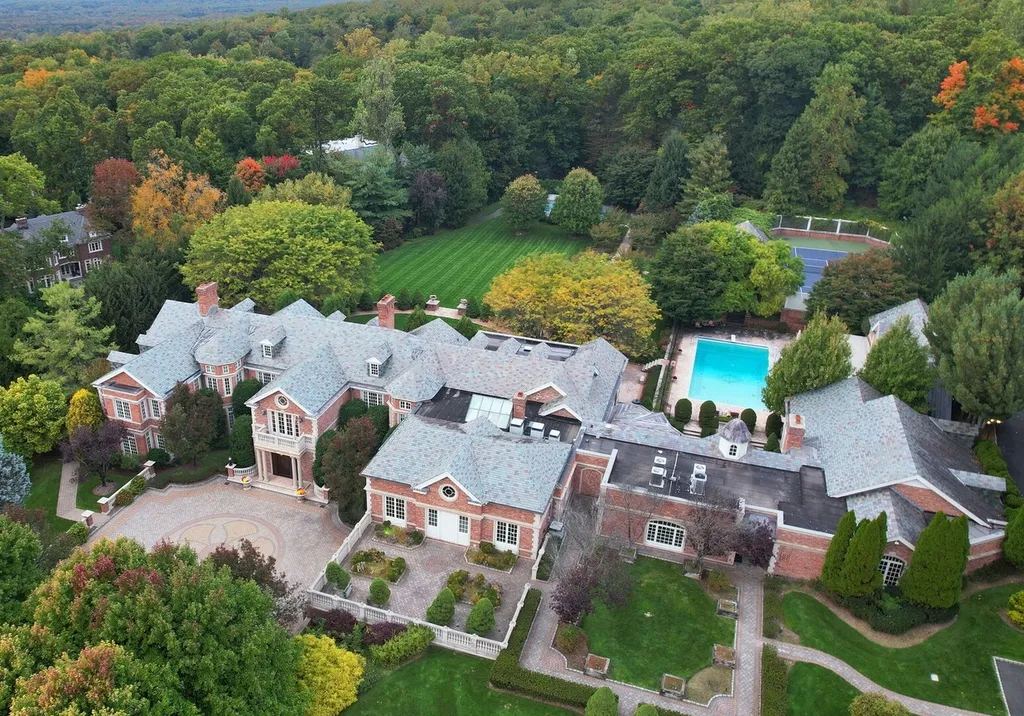 887 Closter Dock Road Home in Alpine, New Jersey. This extraordinary architectural triumph harmoniously blends classic European design with a contemporary touch. Set within an expansive 8-acre property, this magnificent home boasts approximately 35,000 sqft of living space, including the lower level. Prepare to be captivated by the grandeur of the dramatic foyer, generously sized rooms, and an abundance of natural light throughout. With 10 spacious bedroom en suites, 17 bathrooms, a chef's kitchen, formal dining room, family room, and a spectacular great room with a custom bar, every corner of this estate exudes luxury. 