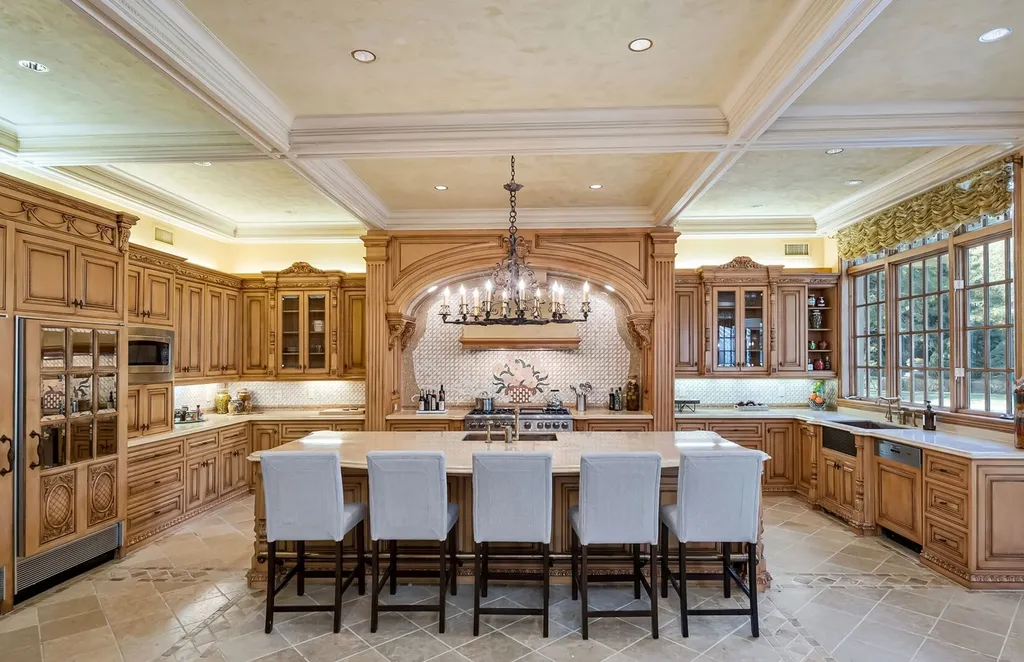 887 Closter Dock Road Home in Alpine, New Jersey. This extraordinary architectural triumph harmoniously blends classic European design with a contemporary touch. Set within an expansive 8-acre property, this magnificent home boasts approximately 35,000 sqft of living space, including the lower level. Prepare to be captivated by the grandeur of the dramatic foyer, generously sized rooms, and an abundance of natural light throughout. With 10 spacious bedroom en suites, 17 bathrooms, a chef's kitchen, formal dining room, family room, and a spectacular great room with a custom bar, every corner of this estate exudes luxury. 