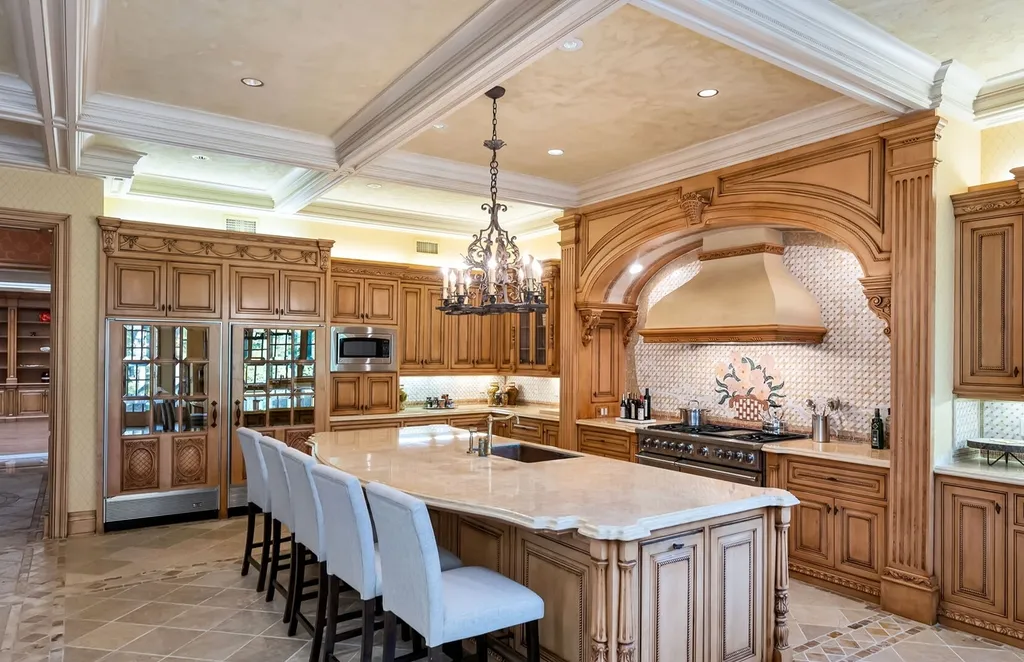 887 Closter Dock Road Home in Alpine, New Jersey. This extraordinary architectural triumph harmoniously blends classic European design with a contemporary touch. Set within an expansive 8-acre property, this magnificent home boasts approximately 35,000 sqft of living space, including the lower level. Prepare to be captivated by the grandeur of the dramatic foyer, generously sized rooms, and an abundance of natural light throughout. With 10 spacious bedroom en suites, 17 bathrooms, a chef's kitchen, formal dining room, family room, and a spectacular great room with a custom bar, every corner of this estate exudes luxury. 