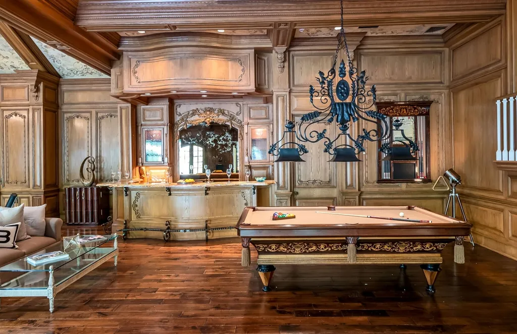 887 Closter Dock Road Home in Alpine, New Jersey. This extraordinary architectural triumph harmoniously blends classic European design with a contemporary touch. Set within an expansive 8-acre property, this magnificent home boasts approximately 35,000 sqft of living space, including the lower level. Prepare to be captivated by the grandeur of the dramatic foyer, generously sized rooms, and an abundance of natural light throughout. With 10 spacious bedroom en suites, 17 bathrooms, a chef's kitchen, formal dining room, family room, and a spectacular great room with a custom bar, every corner of this estate exudes luxury. 