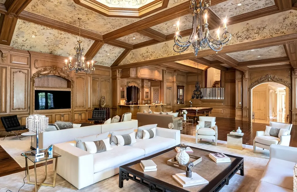 887 Closter Dock Road Home in Alpine, New Jersey. This extraordinary architectural triumph harmoniously blends classic European design with a contemporary touch. Set within an expansive 8-acre property, this magnificent home boasts approximately 35,000 sqft of living space, including the lower level. Prepare to be captivated by the grandeur of the dramatic foyer, generously sized rooms, and an abundance of natural light throughout. With 10 spacious bedroom en suites, 17 bathrooms, a chef's kitchen, formal dining room, family room, and a spectacular great room with a custom bar, every corner of this estate exudes luxury. 