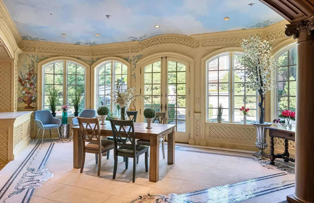 887 Closter Dock Road Home in Alpine, New Jersey. This extraordinary architectural triumph harmoniously blends classic European design with a contemporary touch. Set within an expansive 8-acre property, this magnificent home boasts approximately 35,000 sqft of living space, including the lower level. Prepare to be captivated by the grandeur of the dramatic foyer, generously sized rooms, and an abundance of natural light throughout. With 10 spacious bedroom en suites, 17 bathrooms, a chef's kitchen, formal dining room, family room, and a spectacular great room with a custom bar, every corner of this estate exudes luxury. 