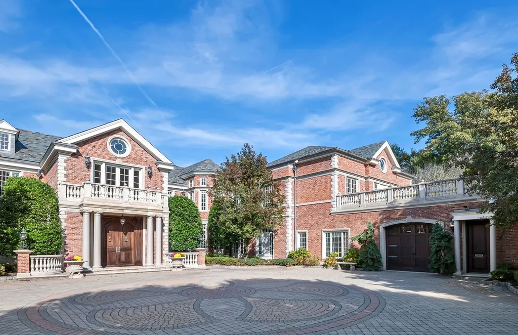 887 Closter Dock Road Home in Alpine, New Jersey. This extraordinary architectural triumph harmoniously blends classic European design with a contemporary touch. Set within an expansive 8-acre property, this magnificent home boasts approximately 35,000 sqft of living space, including the lower level. Prepare to be captivated by the grandeur of the dramatic foyer, generously sized rooms, and an abundance of natural light throughout. With 10 spacious bedroom en suites, 17 bathrooms, a chef's kitchen, formal dining room, family room, and a spectacular great room with a custom bar, every corner of this estate exudes luxury. 