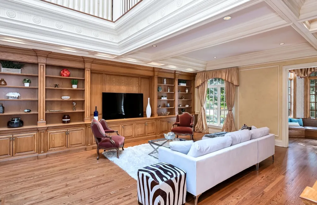 887 Closter Dock Road Home in Alpine, New Jersey. This extraordinary architectural triumph harmoniously blends classic European design with a contemporary touch. Set within an expansive 8-acre property, this magnificent home boasts approximately 35,000 sqft of living space, including the lower level. Prepare to be captivated by the grandeur of the dramatic foyer, generously sized rooms, and an abundance of natural light throughout. With 10 spacious bedroom en suites, 17 bathrooms, a chef's kitchen, formal dining room, family room, and a spectacular great room with a custom bar, every corner of this estate exudes luxury. 