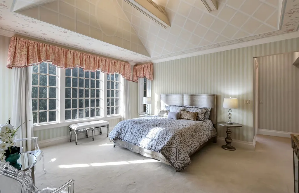 887 Closter Dock Road Home in Alpine, New Jersey. This extraordinary architectural triumph harmoniously blends classic European design with a contemporary touch. Set within an expansive 8-acre property, this magnificent home boasts approximately 35,000 sqft of living space, including the lower level. Prepare to be captivated by the grandeur of the dramatic foyer, generously sized rooms, and an abundance of natural light throughout. With 10 spacious bedroom en suites, 17 bathrooms, a chef's kitchen, formal dining room, family room, and a spectacular great room with a custom bar, every corner of this estate exudes luxury. 
