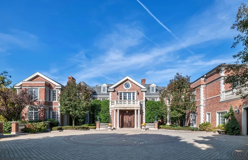 887 Closter Dock Road Home in Alpine, New Jersey. This extraordinary architectural triumph harmoniously blends classic European design with a contemporary touch. Set within an expansive 8-acre property, this magnificent home boasts approximately 35,000 sqft of living space, including the lower level. Prepare to be captivated by the grandeur of the dramatic foyer, generously sized rooms, and an abundance of natural light throughout. With 10 spacious bedroom en suites, 17 bathrooms, a chef's kitchen, formal dining room, family room, and a spectacular great room with a custom bar, every corner of this estate exudes luxury. 