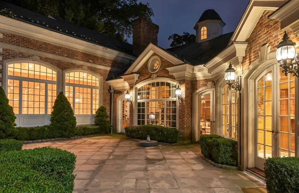 887 Closter Dock Road Home in Alpine, New Jersey. This extraordinary architectural triumph harmoniously blends classic European design with a contemporary touch. Set within an expansive 8-acre property, this magnificent home boasts approximately 35,000 sqft of living space, including the lower level. Prepare to be captivated by the grandeur of the dramatic foyer, generously sized rooms, and an abundance of natural light throughout. With 10 spacious bedroom en suites, 17 bathrooms, a chef's kitchen, formal dining room, family room, and a spectacular great room with a custom bar, every corner of this estate exudes luxury. 