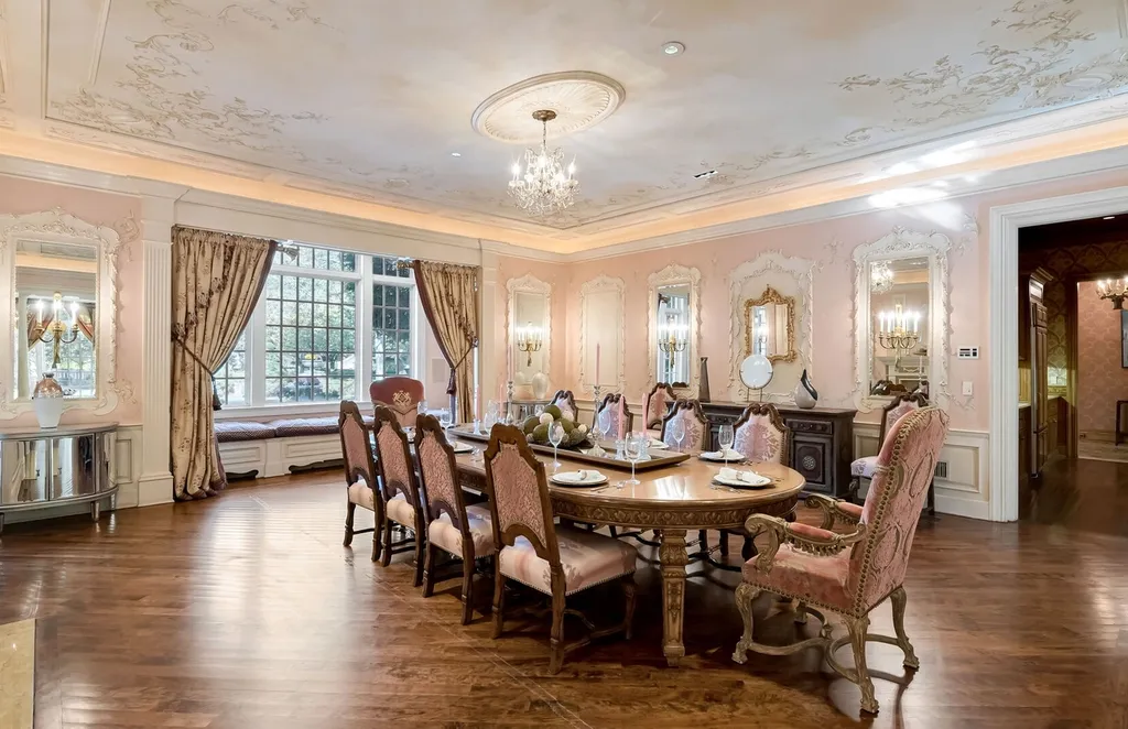 887 Closter Dock Road Home in Alpine, New Jersey. This extraordinary architectural triumph harmoniously blends classic European design with a contemporary touch. Set within an expansive 8-acre property, this magnificent home boasts approximately 35,000 sqft of living space, including the lower level. Prepare to be captivated by the grandeur of the dramatic foyer, generously sized rooms, and an abundance of natural light throughout. With 10 spacious bedroom en suites, 17 bathrooms, a chef's kitchen, formal dining room, family room, and a spectacular great room with a custom bar, every corner of this estate exudes luxury. 