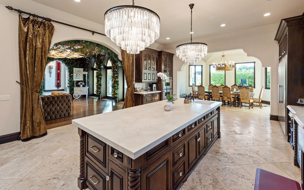9 Beverly Ridge Terrace Home in Beverly Hills, California. Nestled behind double guard gates in the prestigious Beverly Ridge Estates, this custom-built Italian Romanticism-inspired home boasts modern-day conveniences while showcasing the intricately designed craftsmanship of renowned architect, Robert Rivani.