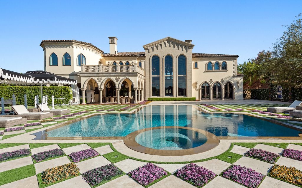 9 Beverly Ridge Terrace Home in Beverly Hills, California. Nestled behind double guard gates in the prestigious Beverly Ridge Estates, this custom-built Italian Romanticism-inspired home boasts modern-day conveniences while showcasing the intricately designed craftsmanship of renowned architect, Robert Rivani.