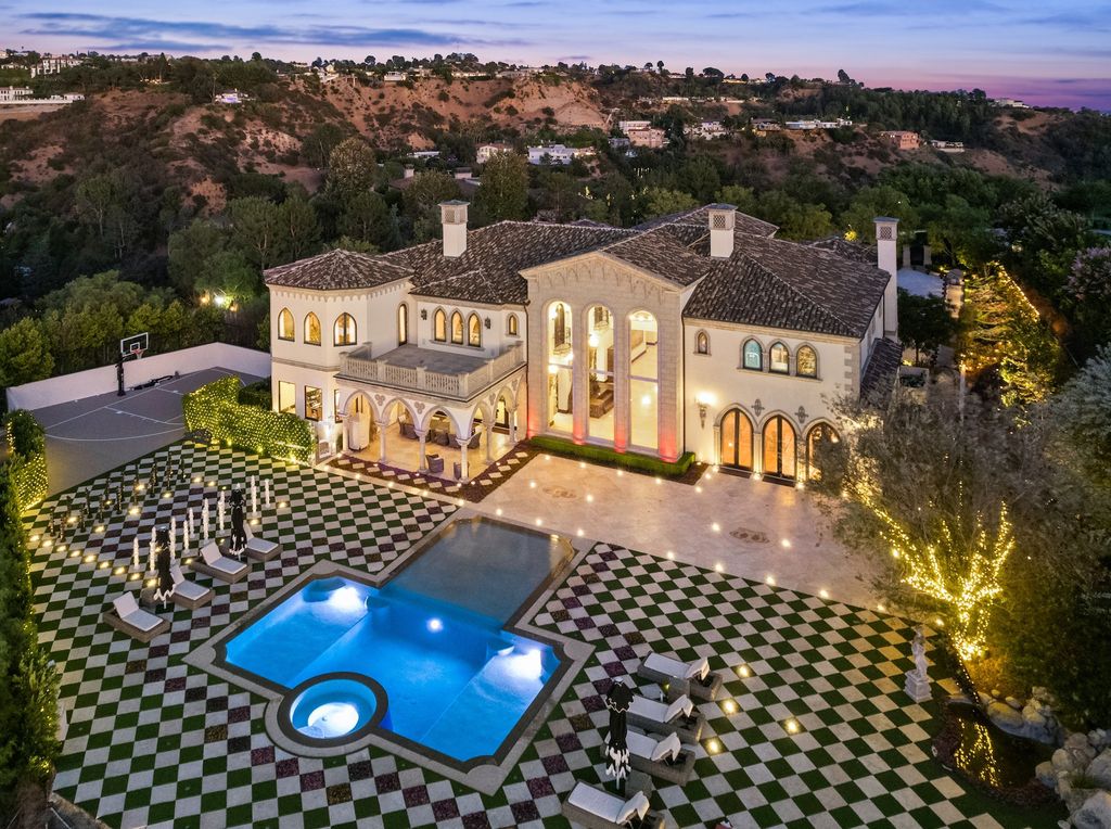 9 Beverly Ridge Terrace Home in Beverly Hills, California. Nestled behind double guard gates in the prestigious Beverly Ridge Estates, this custom-built Italian Romanticism-inspired home boasts modern-day conveniences while showcasing the intricately designed craftsmanship of renowned architect, Robert Rivani.