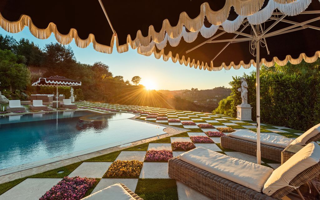 9 Beverly Ridge Terrace Home in Beverly Hills, California. Nestled behind double guard gates in the prestigious Beverly Ridge Estates, this custom-built Italian Romanticism-inspired home boasts modern-day conveniences while showcasing the intricately designed craftsmanship of renowned architect, Robert Rivani.