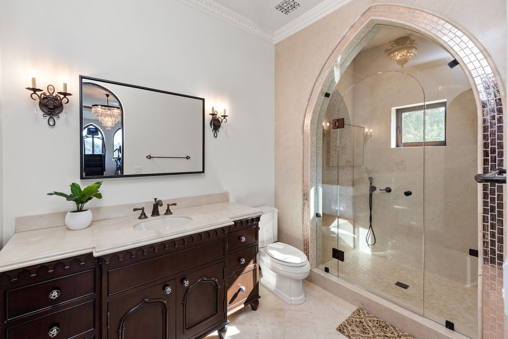 9 Beverly Ridge Terrace Home in Beverly Hills, California. Nestled behind double guard gates in the prestigious Beverly Ridge Estates, this custom-built Italian Romanticism-inspired home boasts modern-day conveniences while showcasing the intricately designed craftsmanship of renowned architect, Robert Rivani.