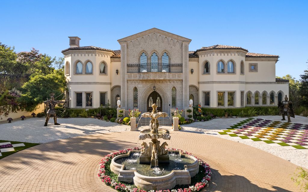 9 Beverly Ridge Terrace Home in Beverly Hills, California. Nestled behind double guard gates in the prestigious Beverly Ridge Estates, this custom-built Italian Romanticism-inspired home boasts modern-day conveniences while showcasing the intricately designed craftsmanship of renowned architect, Robert Rivani.