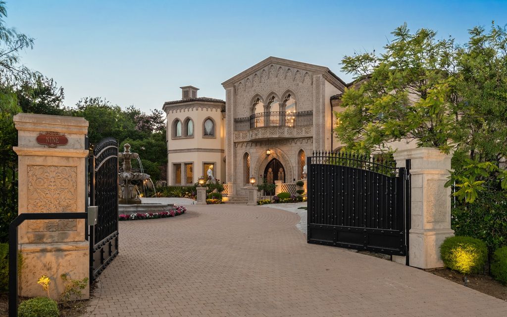 9 Beverly Ridge Terrace Home in Beverly Hills, California. Nestled behind double guard gates in the prestigious Beverly Ridge Estates, this custom-built Italian Romanticism-inspired home boasts modern-day conveniences while showcasing the intricately designed craftsmanship of renowned architect, Robert Rivani.