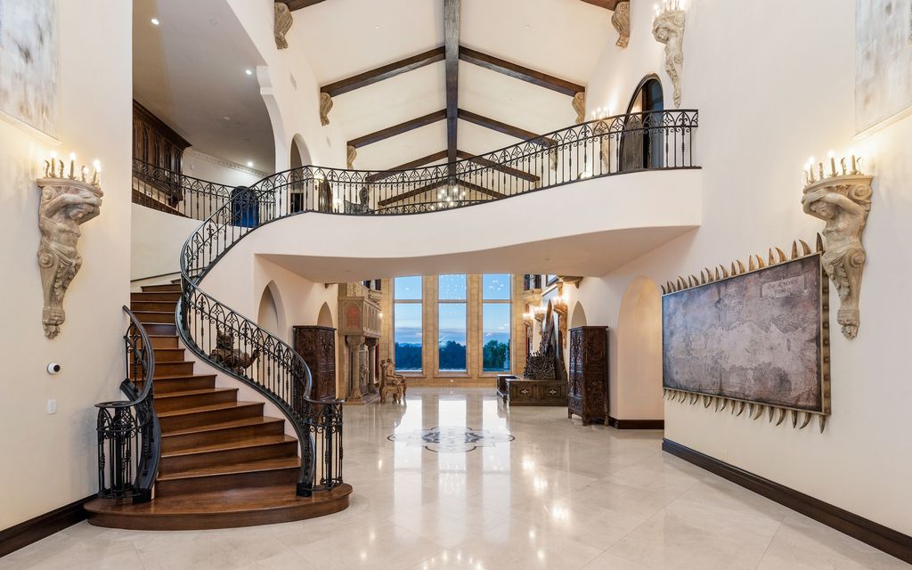 9 Beverly Ridge Terrace Home in Beverly Hills, California. Nestled behind double guard gates in the prestigious Beverly Ridge Estates, this custom-built Italian Romanticism-inspired home boasts modern-day conveniences while showcasing the intricately designed craftsmanship of renowned architect, Robert Rivani.