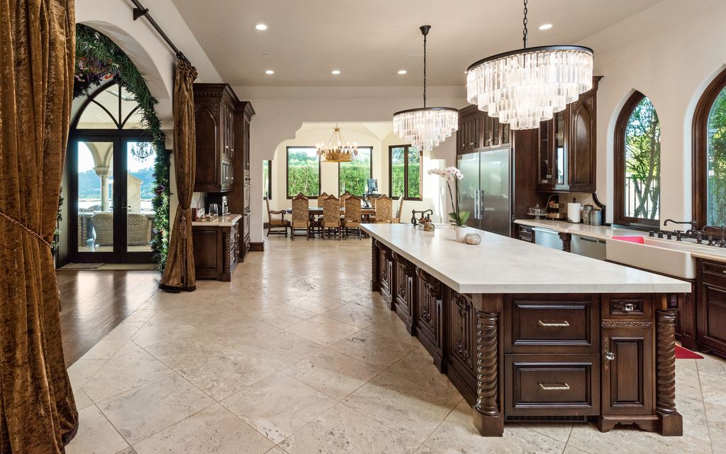 9 Beverly Ridge Terrace Home in Beverly Hills, California. Nestled behind double guard gates in the prestigious Beverly Ridge Estates, this custom-built Italian Romanticism-inspired home boasts modern-day conveniences while showcasing the intricately designed craftsmanship of renowned architect, Robert Rivani.