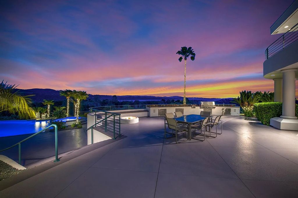 9125 Vista De Lago Court Home in Granite Bay, California. This grand estate is located at the highest point of Los Lagos, providing breathtaking views of Folsom Lake, the Sierra Nevada Mountains, and the Sacramento skyline. The main house boasts over 11,500 square feet while the guest house offers an additional 5,200 square feet.