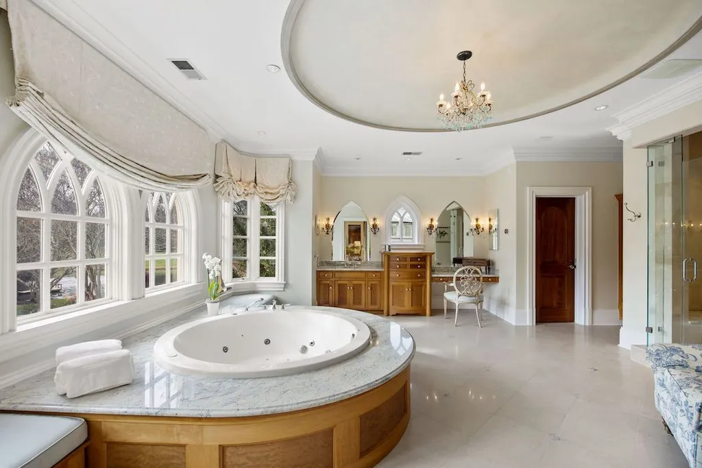 9351 Cornwell Farm Drive Home in Great Falls, Virginia. Experience the epitome of refined living at Wildersmoor House, an extraordinary blend of old-world craftsmanship and modern luxury. Set on a sprawling 17.3-acre estate in the serene hills of Great Falls, Virginia, this secluded residence offers a perfect balance of privacy and convenience.