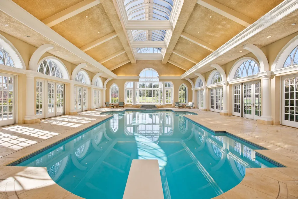 9351 Cornwell Farm Drive Home in Great Falls, Virginia. Experience the epitome of refined living at Wildersmoor House, an extraordinary blend of old-world craftsmanship and modern luxury. Set on a sprawling 17.3-acre estate in the serene hills of Great Falls, Virginia, this secluded residence offers a perfect balance of privacy and convenience.