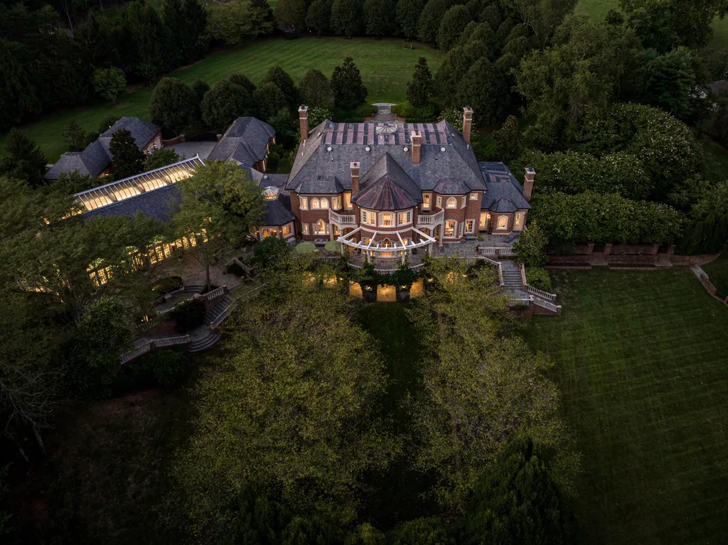 9351 Cornwell Farm Drive Home in Great Falls, Virginia. Experience the epitome of refined living at Wildersmoor House, an extraordinary blend of old-world craftsmanship and modern luxury. Set on a sprawling 17.3-acre estate in the serene hills of Great Falls, Virginia, this secluded residence offers a perfect balance of privacy and convenience.