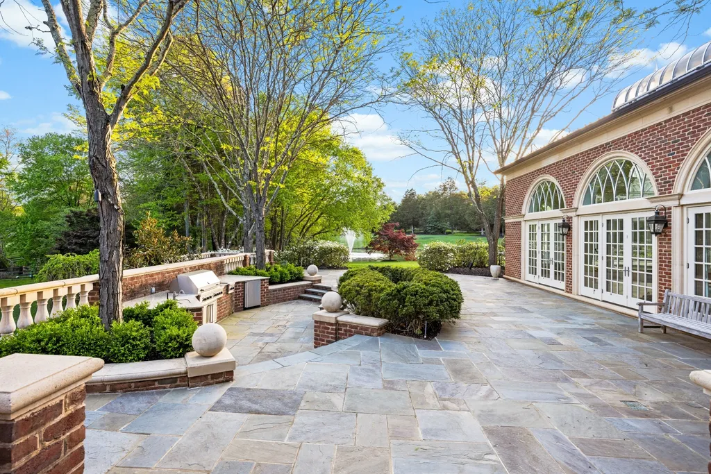 9351 Cornwell Farm Drive Home in Great Falls, Virginia. Experience the epitome of refined living at Wildersmoor House, an extraordinary blend of old-world craftsmanship and modern luxury. Set on a sprawling 17.3-acre estate in the serene hills of Great Falls, Virginia, this secluded residence offers a perfect balance of privacy and convenience.