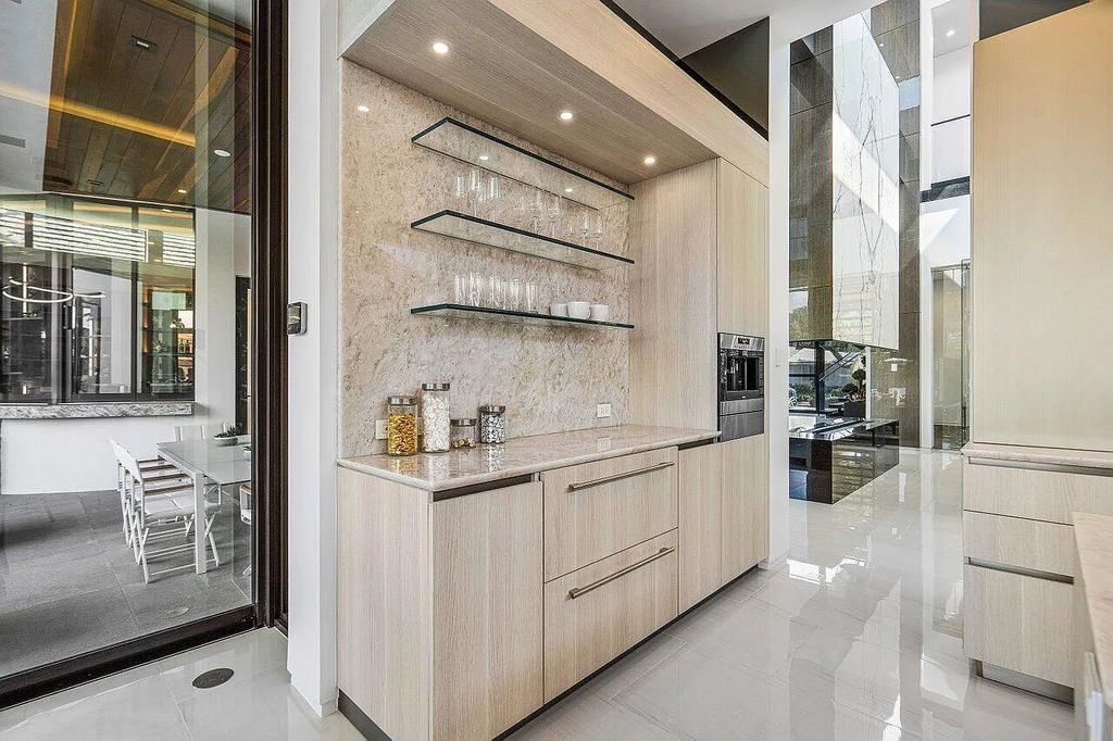 Discover 650 Tern Point Circle, Boca Raton, Florida—a stunning waterfront estate in The Sanctuary. This brand-new residence offers 6 beds, 10 baths, and 8,826 sq ft. With bright Southern Exposure, soaring ceilings, and elegant design, it's a true masterpiece.