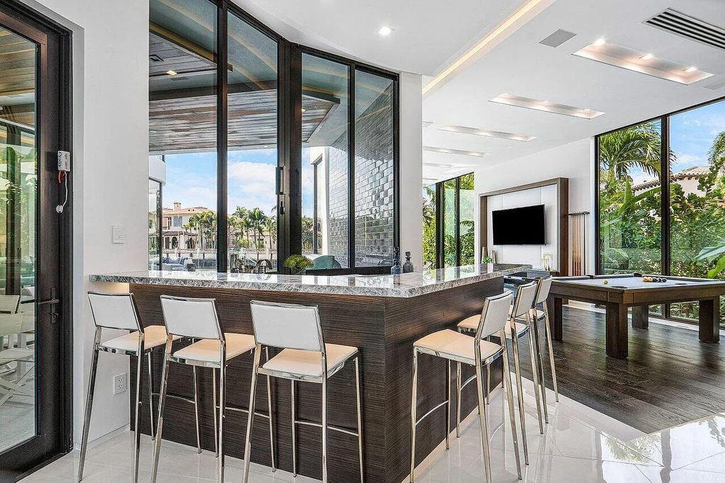 Discover 650 Tern Point Circle, Boca Raton, Florida—a stunning waterfront estate in The Sanctuary. This brand-new residence offers 6 beds, 10 baths, and 8,826 sq ft. With bright Southern Exposure, soaring ceilings, and elegant design, it's a true masterpiece.