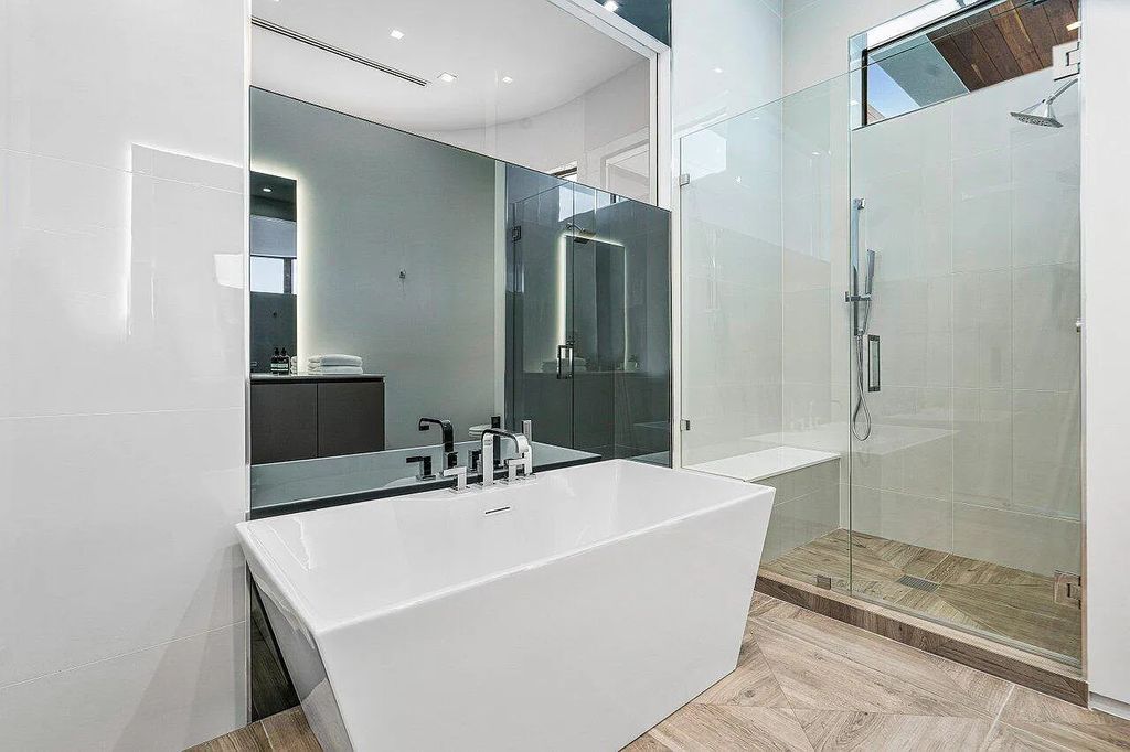 Discover 650 Tern Point Circle, Boca Raton, Florida—a stunning waterfront estate in The Sanctuary. This brand-new residence offers 6 beds, 10 baths, and 8,826 sq ft. With bright Southern Exposure, soaring ceilings, and elegant design, it's a true masterpiece.