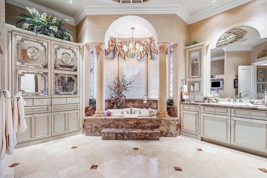Welcome to 2330 Seven Oaks Lane, Palm Beach Gardens, Florida! This majestic waterfront estate sprawls nearly 3 acres of direct intracoastal waterway, offering 150' of deep water access and a no wake zone.