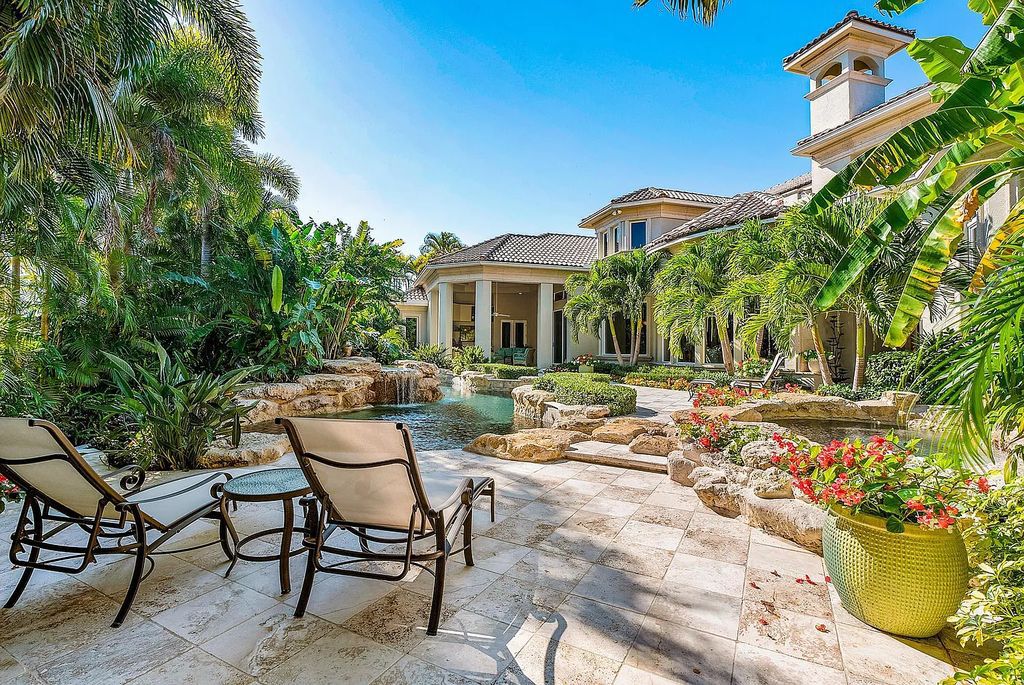 Discover unparalleled beauty in this prestigious waterfront estate located at 174 W Coconut Palm Road, Boca Raton's Royal Palm Yacht & Country Club, Florida. With captivating waterway views, this architectural marvel offers a tropical oasis on over half an acre of lush greenery.