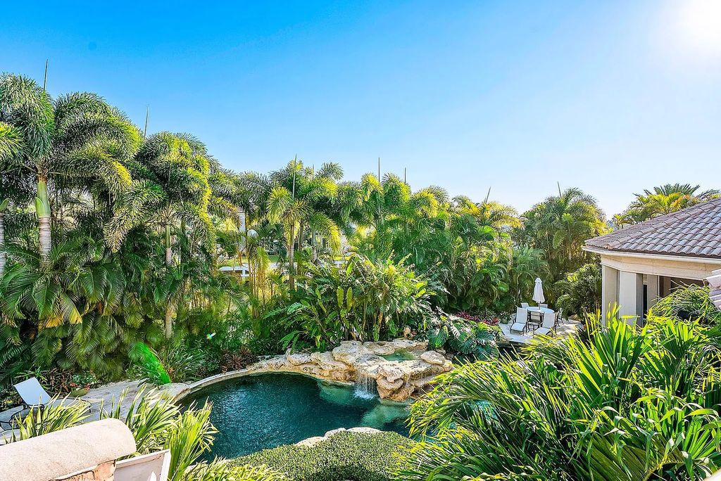 Discover unparalleled beauty in this prestigious waterfront estate located at 174 W Coconut Palm Road, Boca Raton's Royal Palm Yacht & Country Club, Florida. With captivating waterway views, this architectural marvel offers a tropical oasis on over half an acre of lush greenery.