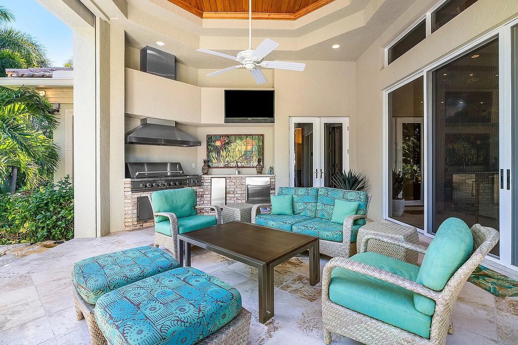 Discover unparalleled beauty in this prestigious waterfront estate located at 174 W Coconut Palm Road, Boca Raton's Royal Palm Yacht & Country Club, Florida. With captivating waterway views, this architectural marvel offers a tropical oasis on over half an acre of lush greenery.