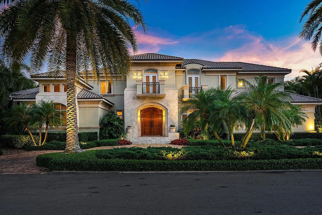 Discover unparalleled beauty in this prestigious waterfront estate located at 174 W Coconut Palm Road, Boca Raton's Royal Palm Yacht & Country Club, Florida. With captivating waterway views, this architectural marvel offers a tropical oasis on over half an acre of lush greenery.
