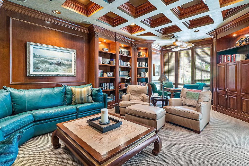 Discover unparalleled beauty in this prestigious waterfront estate located at 174 W Coconut Palm Road, Boca Raton's Royal Palm Yacht & Country Club, Florida. With captivating waterway views, this architectural marvel offers a tropical oasis on over half an acre of lush greenery.