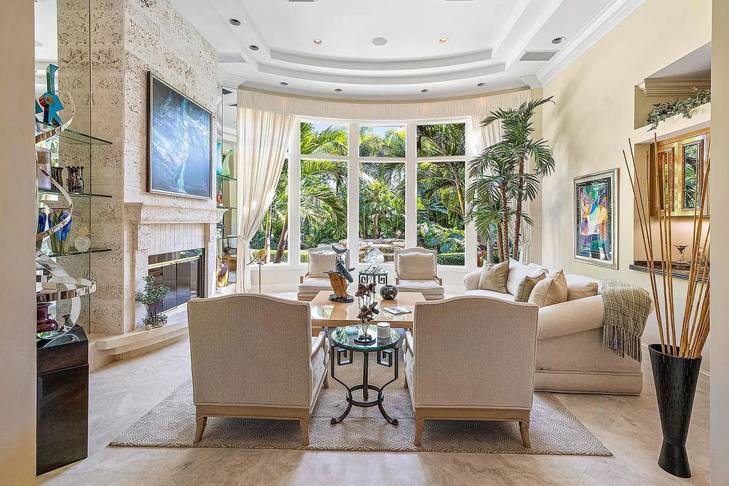 Discover unparalleled beauty in this prestigious waterfront estate located at 174 W Coconut Palm Road, Boca Raton's Royal Palm Yacht & Country Club, Florida. With captivating waterway views, this architectural marvel offers a tropical oasis on over half an acre of lush greenery.